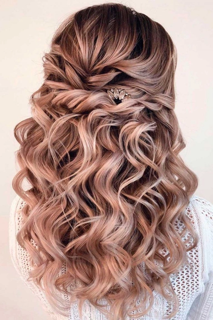 Graduate with a comfortable low bun hairstyle perfect for long graduation events