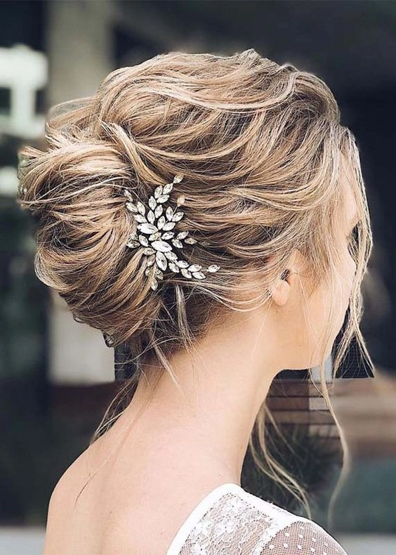 Elegant French twist graduation updo with pinned curls and subtle highlights