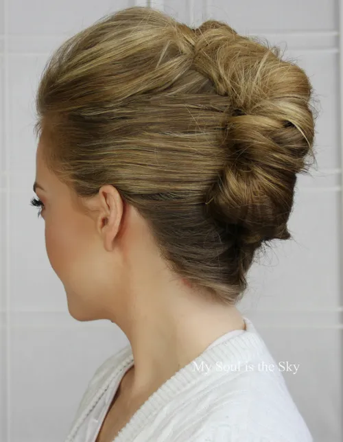 French twist graduation updo with elegant twisted details