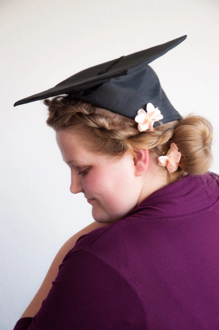 Graduation cap positioned over voluminous hairstyle with tips for hair volume
