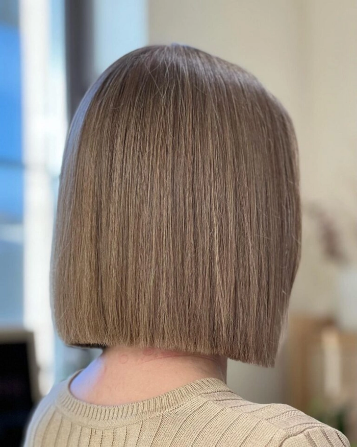 Sleek Blunt Bob for Graduation Graduation hairstyle with a sleek blunt bob cut and subtle waves for a polished look