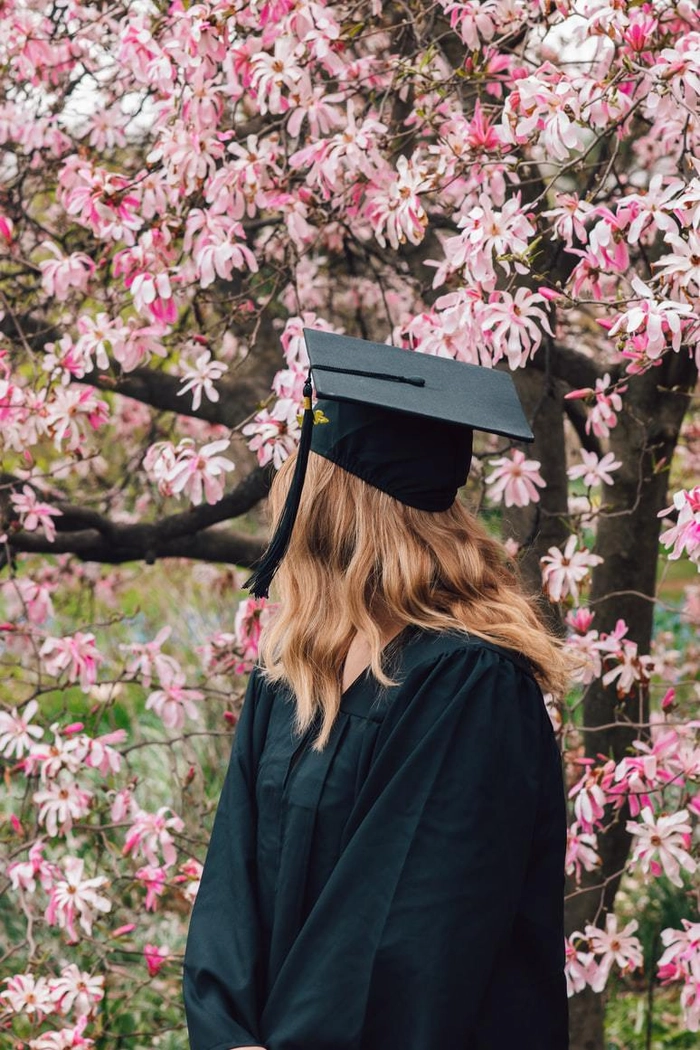 College graduate with a sleek low bun and graduation cap