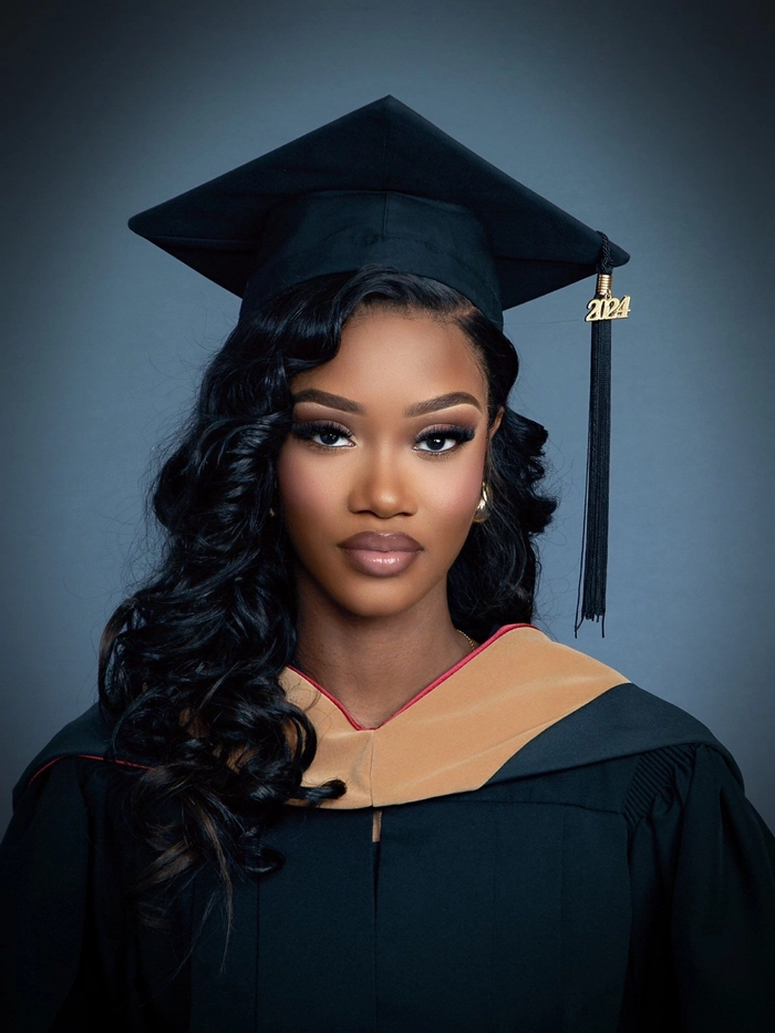 Elegant graduation hairstyle for college graduates with soft curls and a decorative hairpin