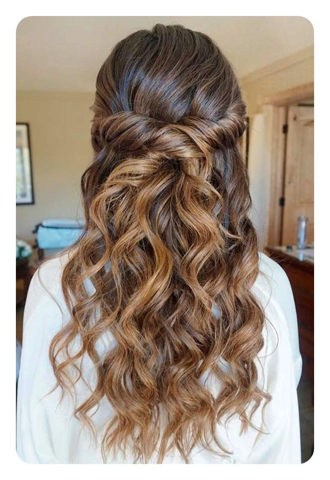 Graduation hairstyle that transitions into a celebratory evening party look with elegant waves and subtle accessories