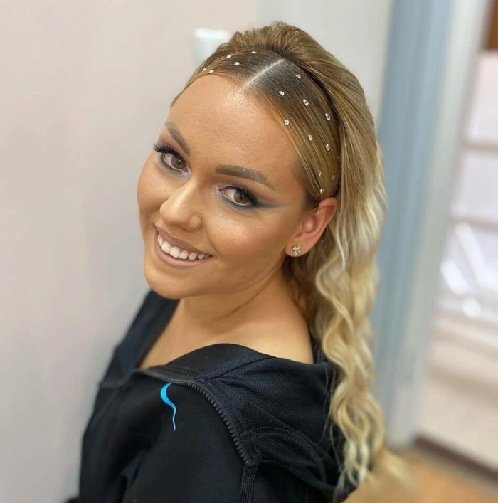 Graduation hairstyle with elegant gold leaf accents for a stunning look