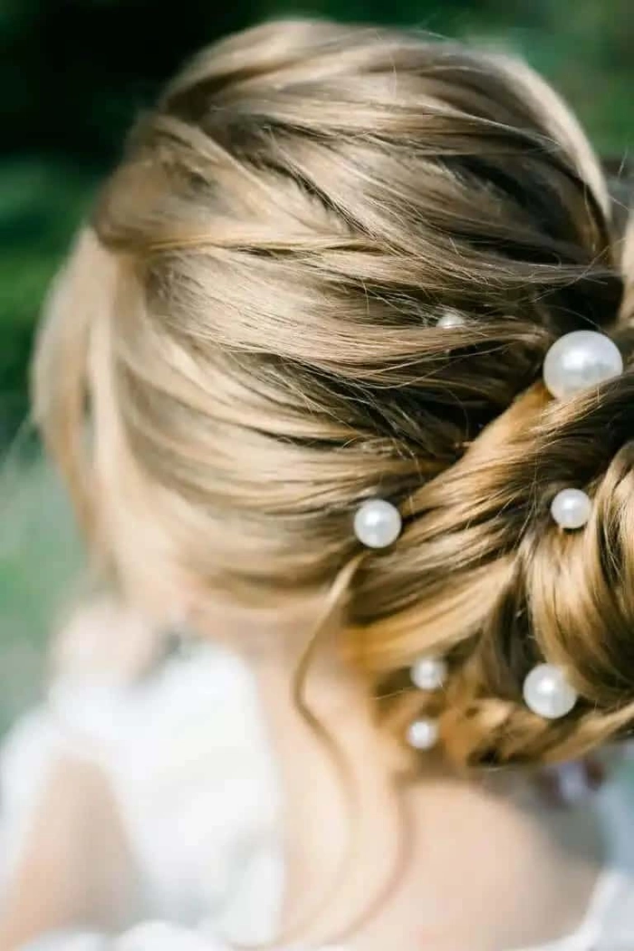 Graduation hairstyle with gold leaf accents, back view featuring intricate leaf placement