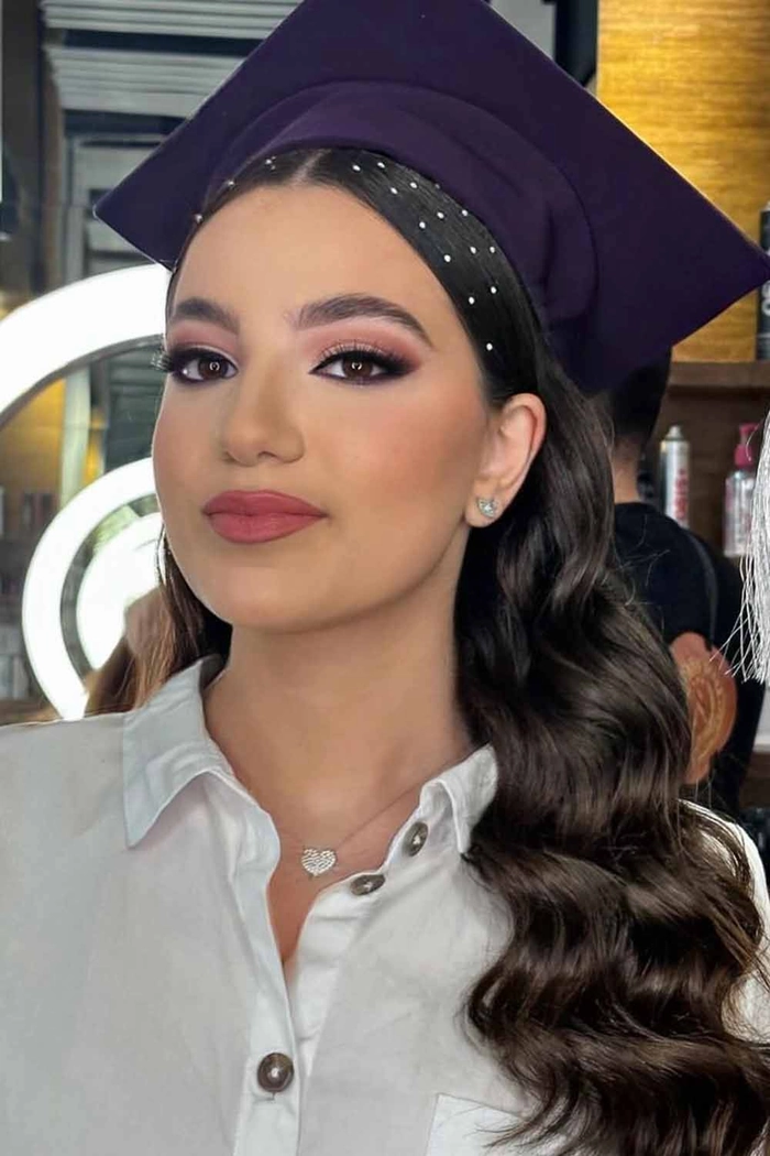Stunning braided crown updo perfect for Latina graduates Beautiful braided crown graduation hairstyle for Latina hair with soft face-framing curls