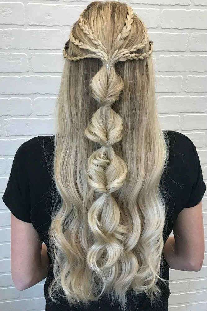 Elegant graduation hairstyle for long hair with cascading curls and a decorative headband