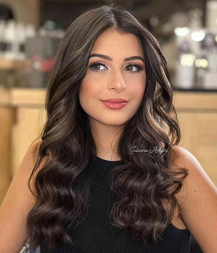 Elegant medium length graduation hairstyle with soft curls and a twirled updo Medium length graduation hairstyle with side-swept waves and a subtle accessory