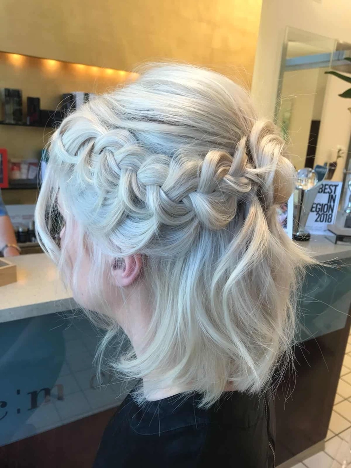 Chic medium length graduation hairstyle with elegant waves and accessories Graduation hairstyle for medium length hair with soft waves and a decorative clip
