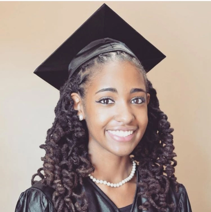 Graduation Hairstyle for Natural Black Hair - Chic Updo with Accessories Graduation hairstyle for natural black hair with a chic updo and decorative accessories