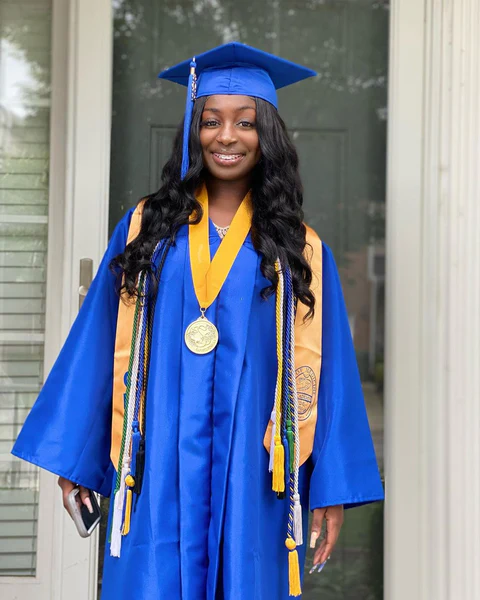Elegant braided crown graduation hairstyle for natural black hair Natural black hair graduation hairstyle with intricate braided crown and edges