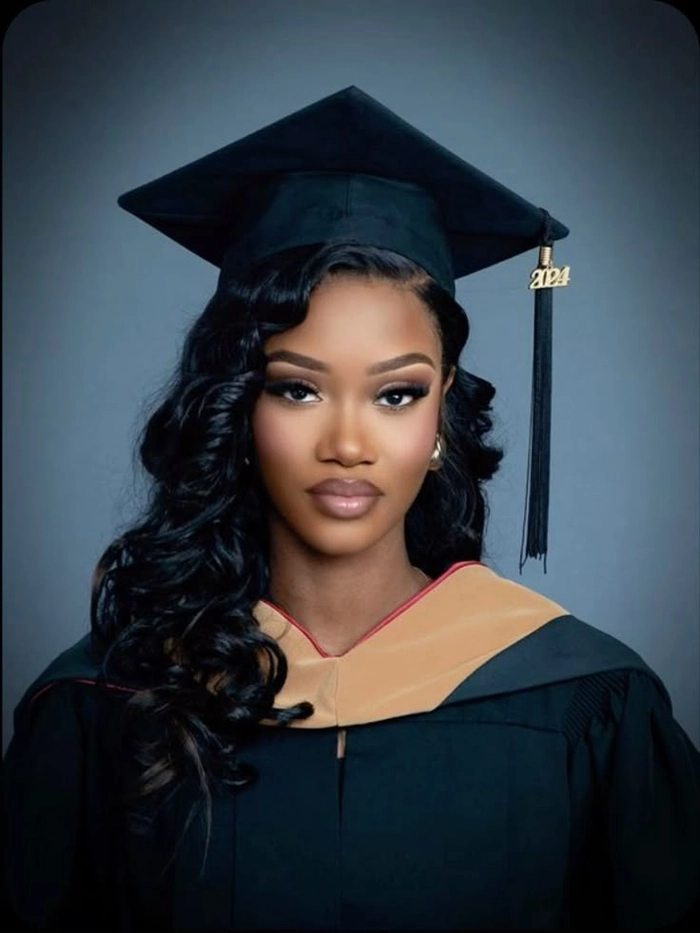Nursing student graduation hairstyle with sleek low bun and cap