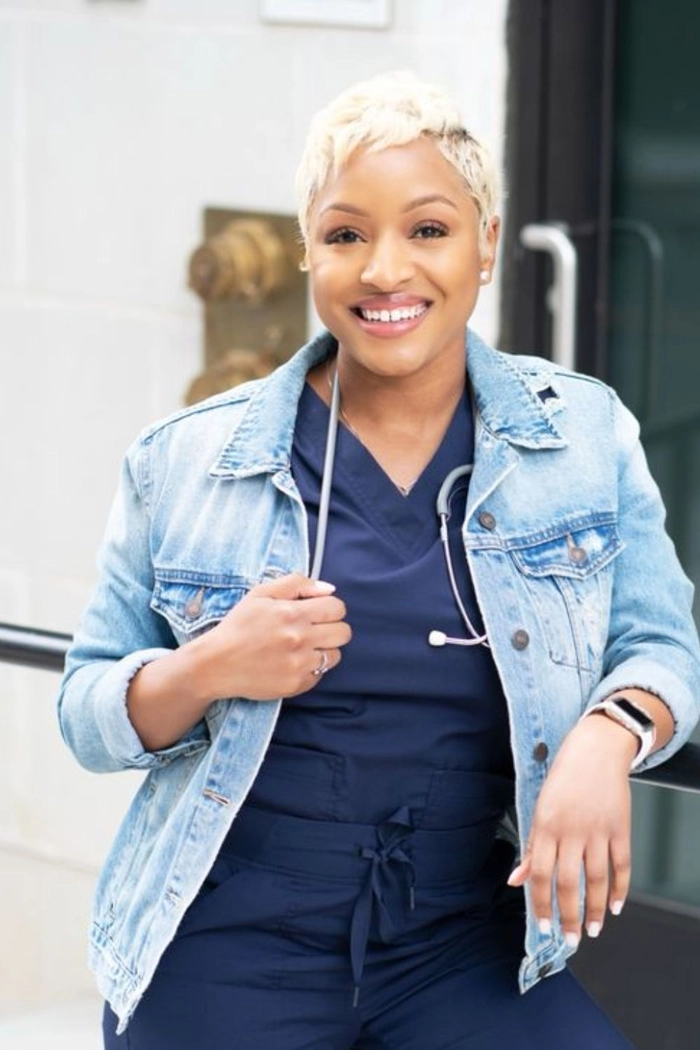 Elegant graduation hairstyle for nursing students with a sleek low bun and decorative pins