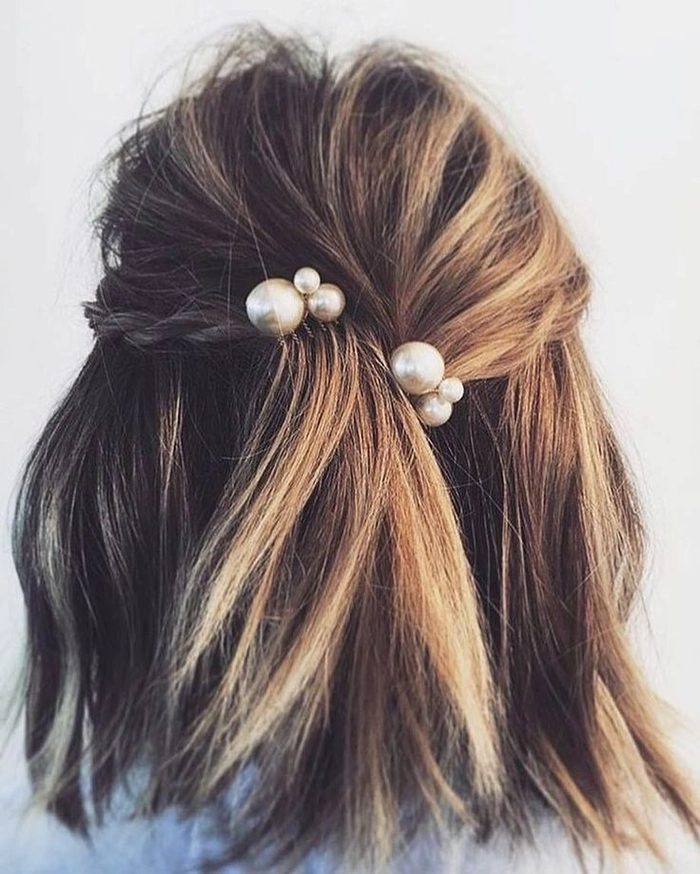 Graduation Hairstyle 5: Pearl Hairpin Accents for a Sophisticated Look Elegant graduation hairstyle with pearl hairpins cascading through soft curls