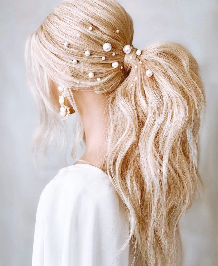 Elegant graduation updo accented by shimmering pearl hairpins Graduation hairstyle with pearl hairpins pinned elegantly