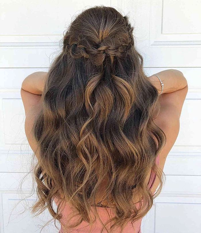 Graduation hairstyle for recently dyed hair featuring elegant waves and a decorative cap