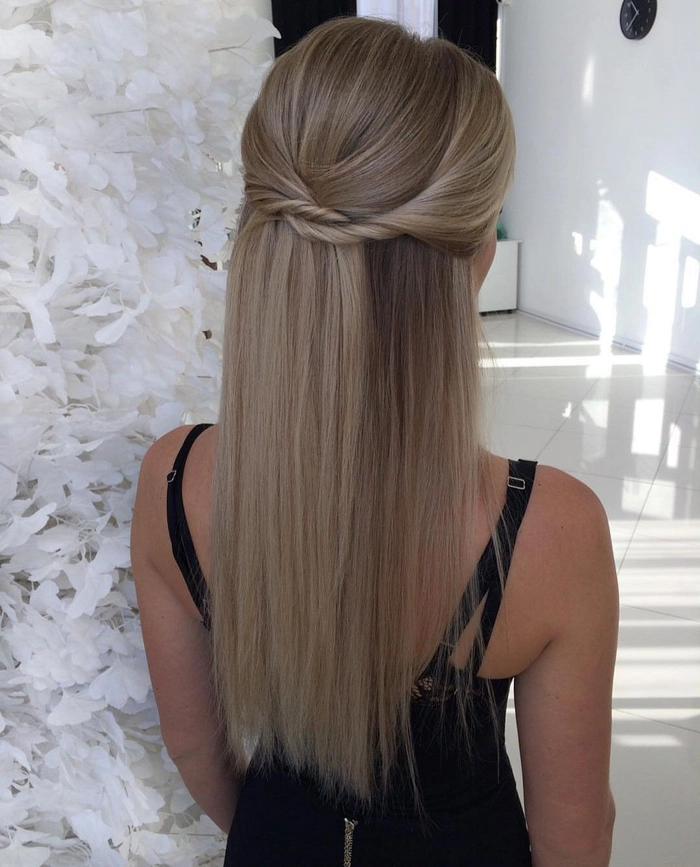 Long straight graduation hairstyle with a sleek center part and smooth finish