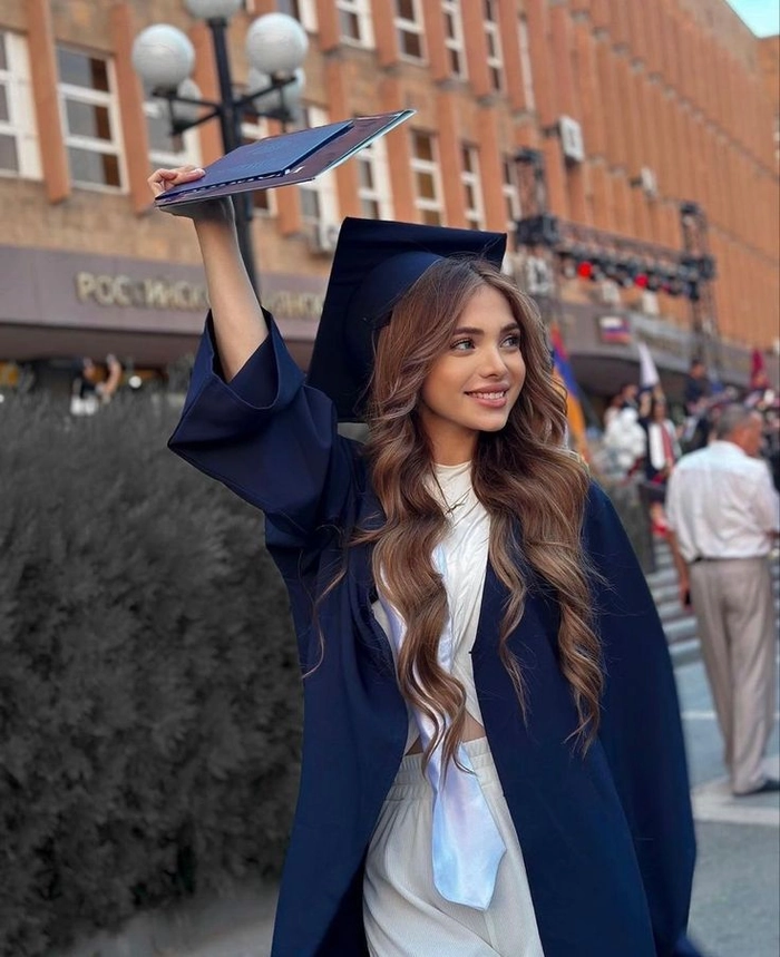 Long hair flowing under graduation cap with subtle waves for a polished ceremony look