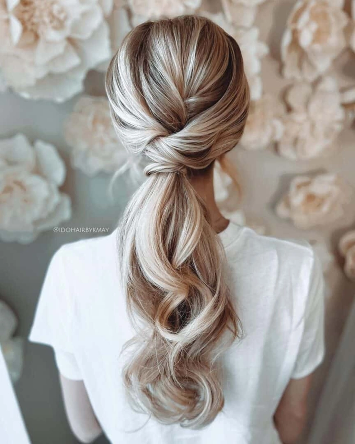 A high ponytail graduation hairstyle with a sleek and polished look