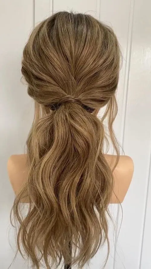 Elegant high ponytail graduation hairstyle with smooth volume