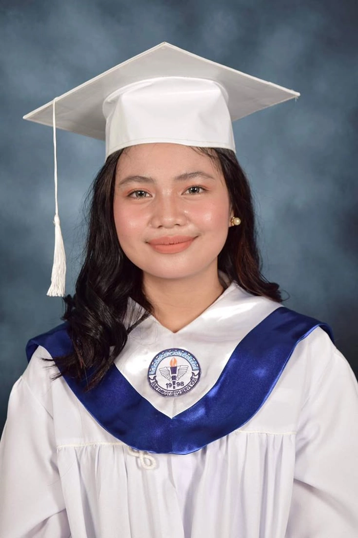 High school graduate with elegant curly updo hairstyle