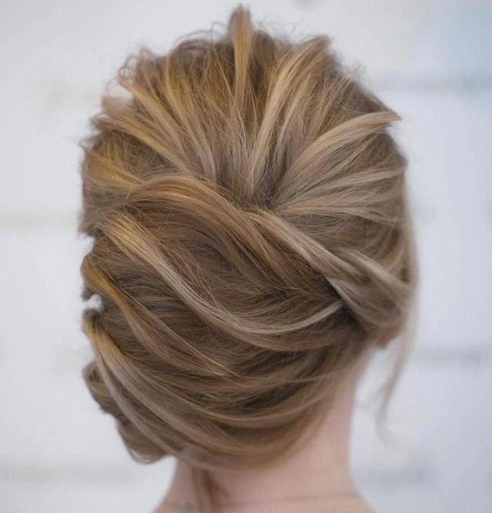Sophisticated French twist graduation updo with side-swept bangs