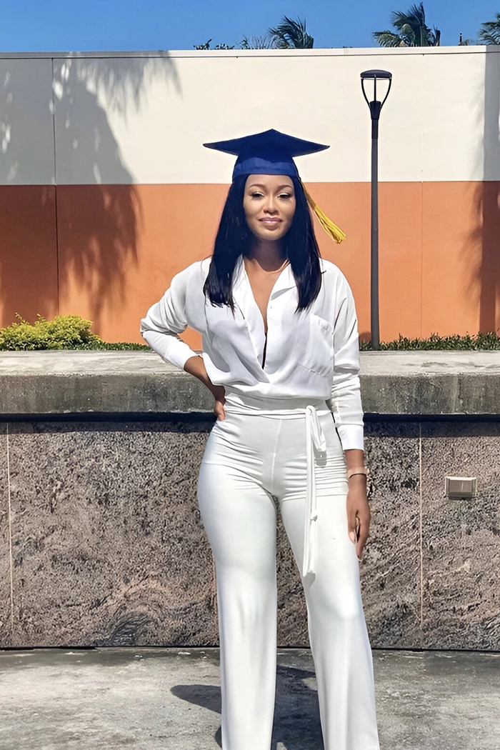 Elegant sweat proof graduation updo with twisted bun and pinned sides