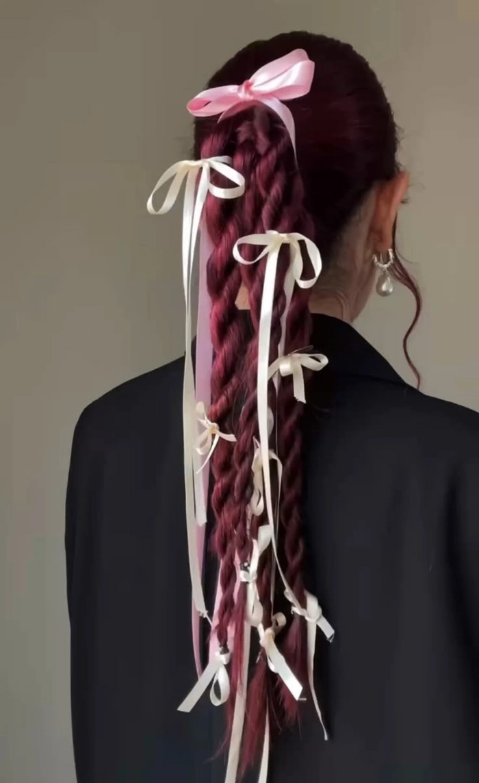 Maximalist graduation hair styling with voluminous curls and glittering accessories