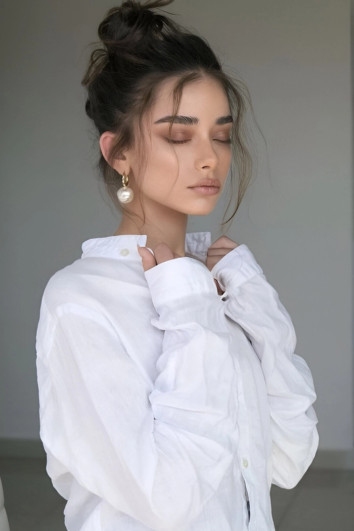 Casual messy bun with graduation cap on top for a relaxed yet chic look