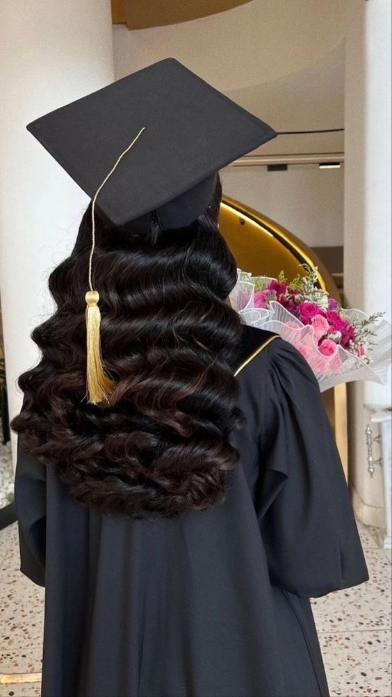 Graduate wearing a minimalist hair clip with small pearl details