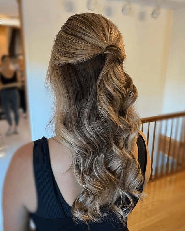 Modern sleek graduation hairstyle with smooth, straight hair and a glossy finish