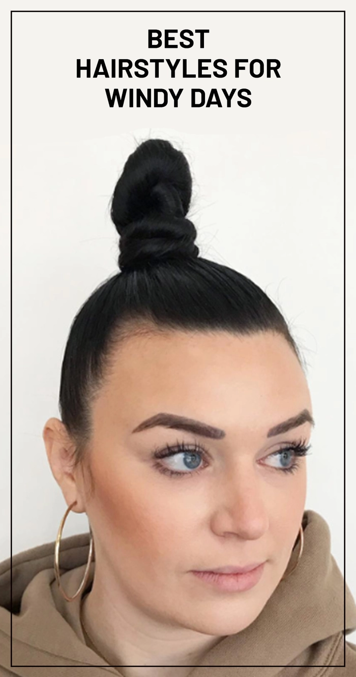 Breezy Braided Updo for Outdoor Graduation Ceremonies Graduate with wind-resistant braided updo and loose tendrils outdoors