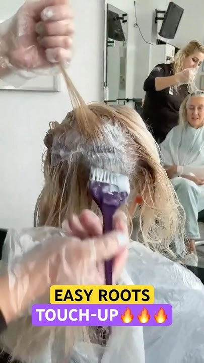 Woman with freshly touched-up roots for her graduation hairstyle