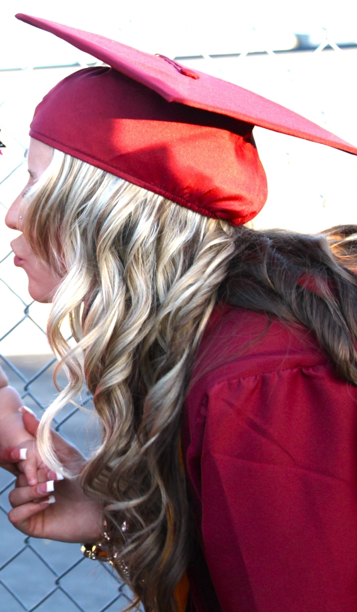 Step-by-step guide for securing a graduation cap to short hair