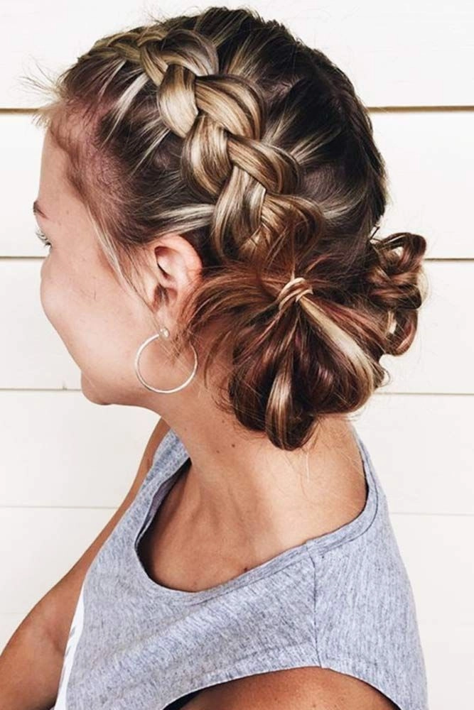 Heat-resistant low bun hairstyle for graduation day comfort Summer graduation hairstyle with low bun and delicate curls for hot weather