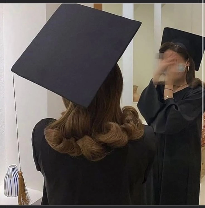 Elegant sweat proof graduation updo with braided crown and secure pins