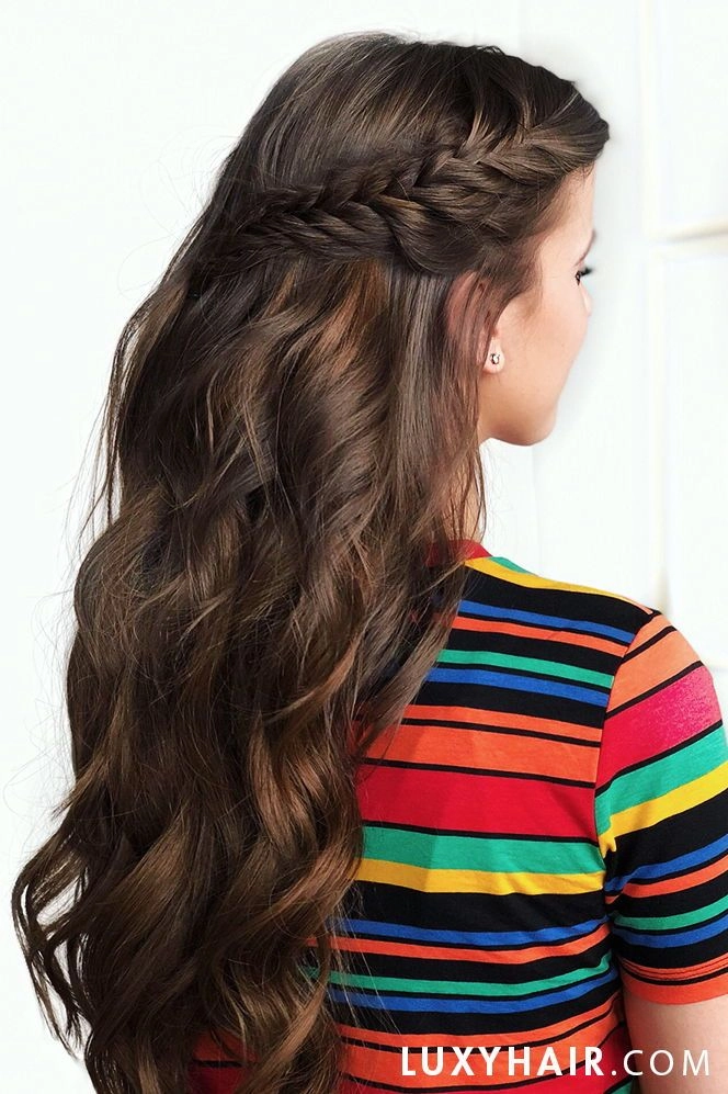 Graduation hairstyle featuring an intricate waterfall braid from crown to ends