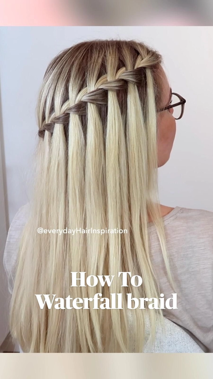 Graduation hairstyle featuring a delicate waterfall braid cascading through loose waves