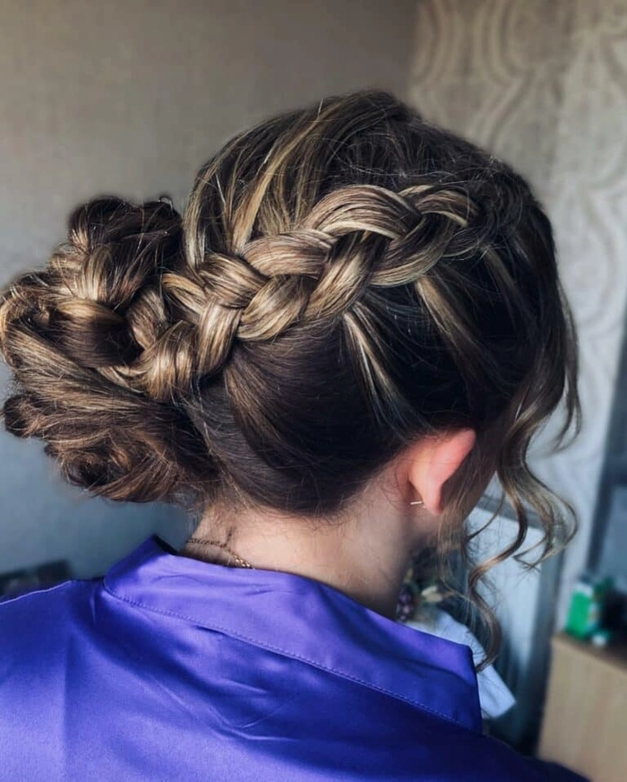 Matching bridesmaid braid styles featuring festive December ceremony details