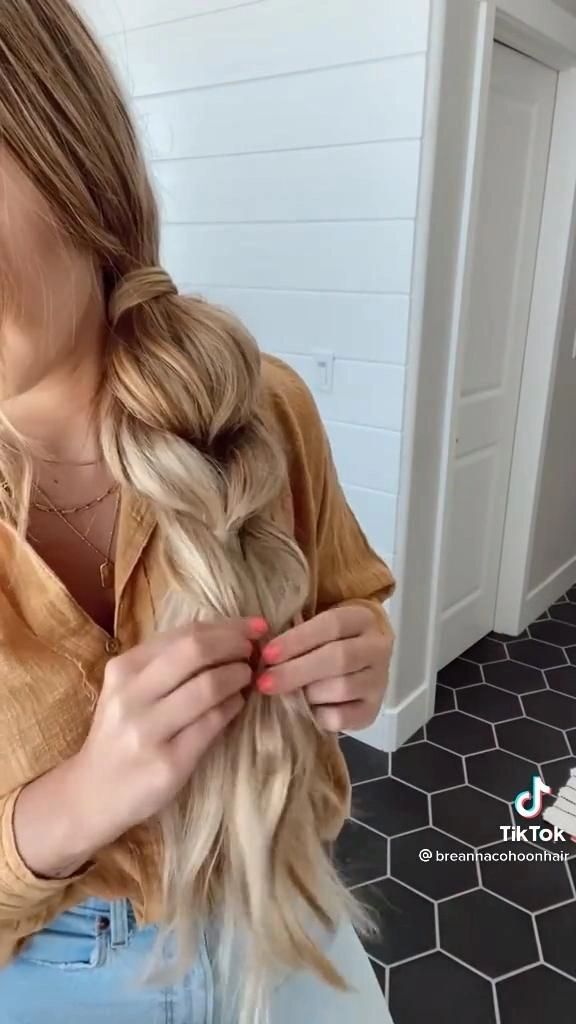Playful Bubble Braid Ponytails for Festive Holiday Party Looks Bubble braid ponytail hairstyle with sparkling holiday accessories