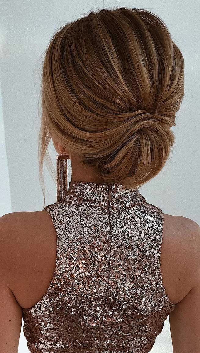 Elegant Christmas party updo for long hair with festive sparkle