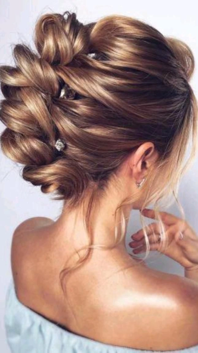 Elegant holiday updo for long hair with twisted bun and sparkly hairpin