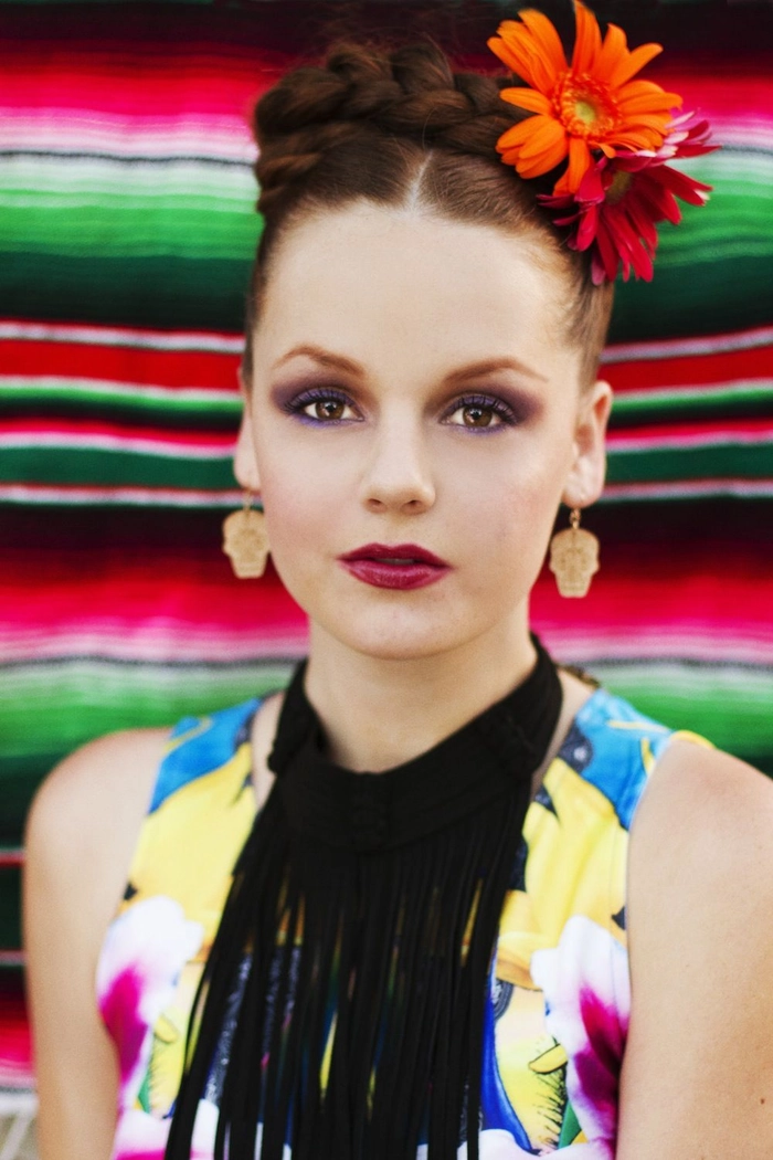 Cinco de Mayo festive braided updo with colorful flower accents for holiday hairstyles