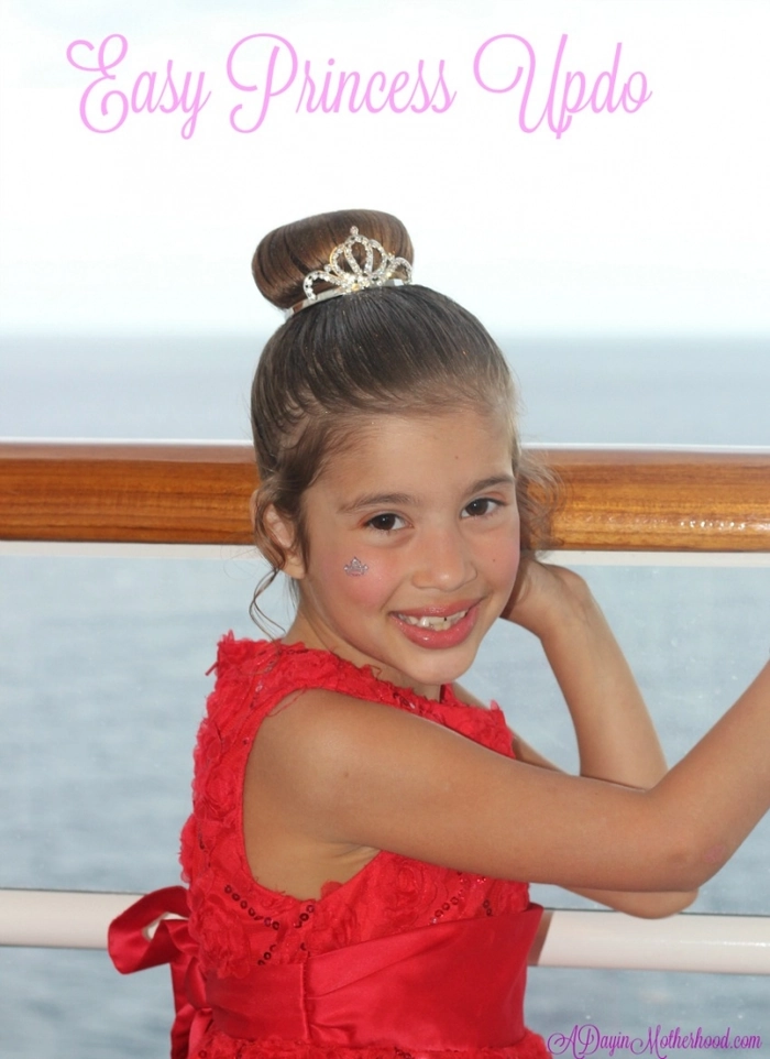 Comfortable updo hairstyle for a child in a holiday pageant, with gentle twists and a festive bow