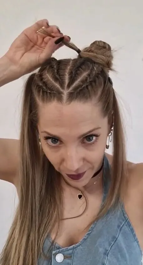 Edgy space buns hairstyle with metallic accessories for alternative New Year's Eve parties