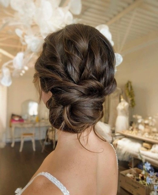 Effortless low bun hairstyle with soft waves, perfect for a family holiday gathering