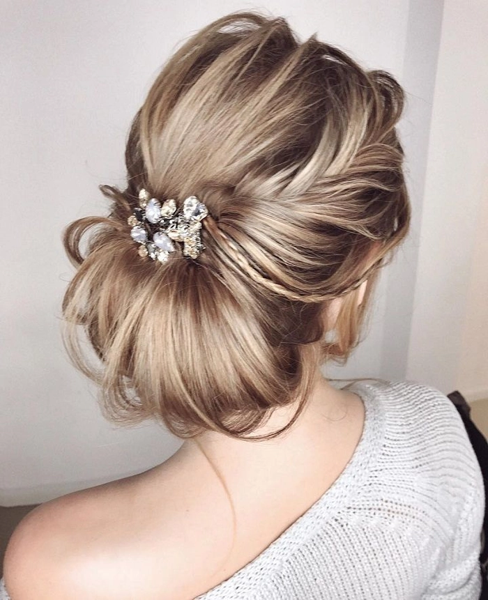 Elegant chignon hairstyle for a winter wedding with subtle hair accessories
