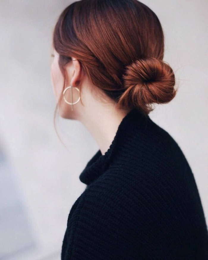 Elegant gray hair styled in an elegant updo with festive accessories for a holiday formal event