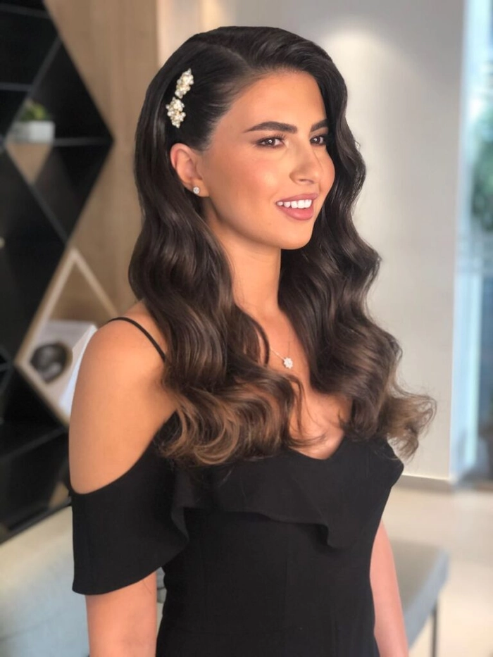 Elegant gray hair styled in a sophisticated updo with sparkling holiday accessories for a formal evening event